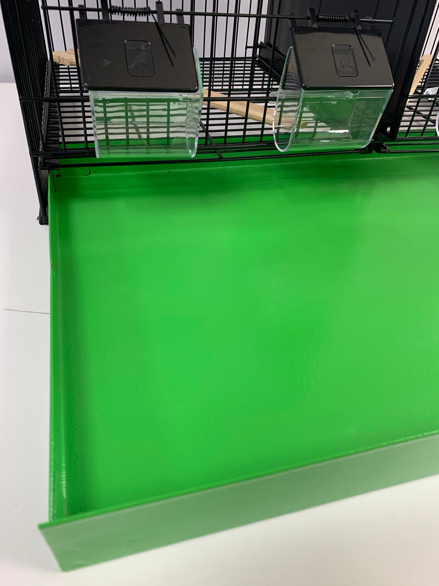 60cm Black Metal Double Breeder Bird Cage with Green Metal Bottom Tray. Size 61cm x 35cm x 42cm.