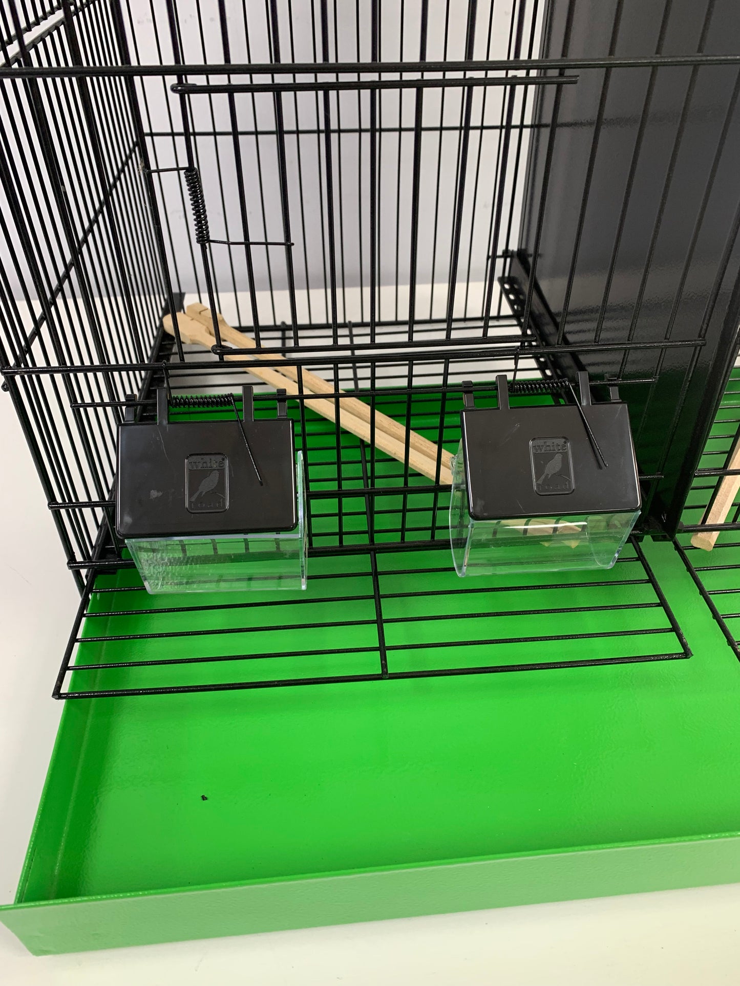 60cm Black Metal Double Breeder Bird Cage with Green Metal Bottom Tray. Size 61cm x 35cm x 42cm.